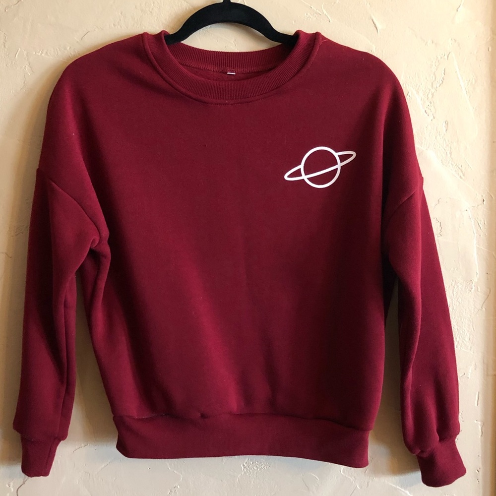 Women’s maroon planet Saturn crewneck